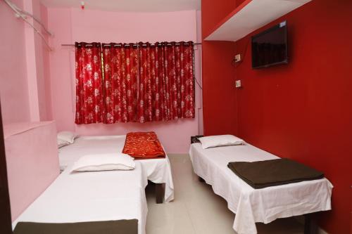 Postel nebo postele na pokoji v ubytování Shree Laxmee Narayan Paying Guest House