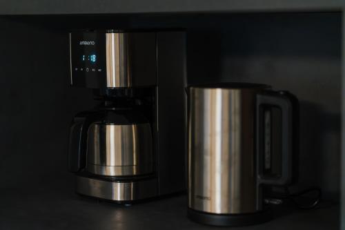 a coffee maker sitting on top of a counter at Nockventure Ferienhaus Gnesau in Gnesau