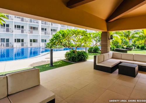 a view of the pool from the patio of a building at NJ's Place, Shore 1 Residences, MOA Complex, Pasay City, Philippines in Manila
