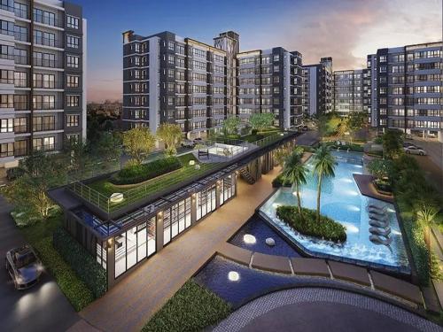 una vista aérea de un edificio con piscina en supalai city resort en Ban Khlong Samrong