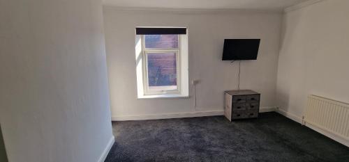 APARTMENT IN CENTRAL BARNSLEYにあるテレビまたはエンターテインメントセンター