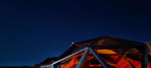 a tent at night with the stars in the sky at Starlit Dome Mcleodganj in Dharamshala
