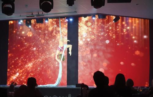a stage with a woman in a dress on a stage at Memories Made in Selsey