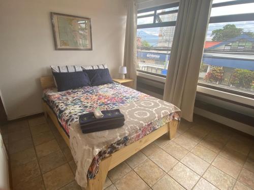 Кровать или кровати в номере Sofia Apartments in Escalante, San Jose Center