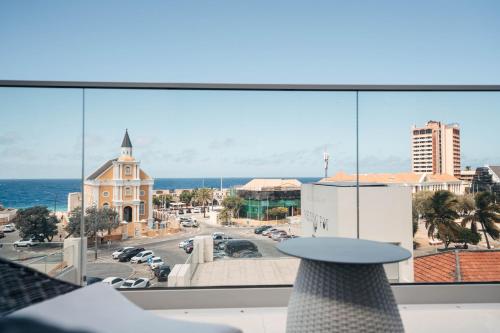 a view of a city from a balcony at Elements Hotel & Shops Curaçao in Willemstad