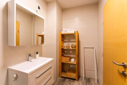 a bathroom with a sink and a mirror at Studio apartman the little Prince in Bjelovar