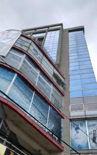 a tall building with windows on the side of it at Adey Ababa Stadium Hotel in Addis Ababa