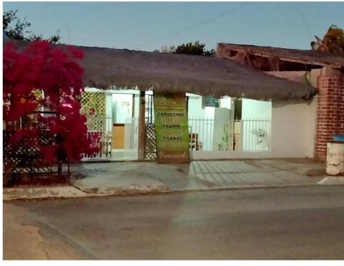 a building with a sign on the front of it at Casa Kayack in San Carlos