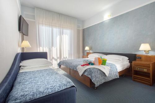 מיטה או מיטות בחדר ב-Hotel Esplanade