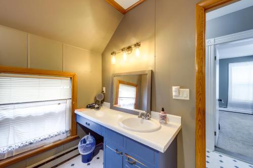 a bathroom with a sink and a mirror at Maine Vacation Rental about 1 Mi to Auburn Riverwalk! in Auburn