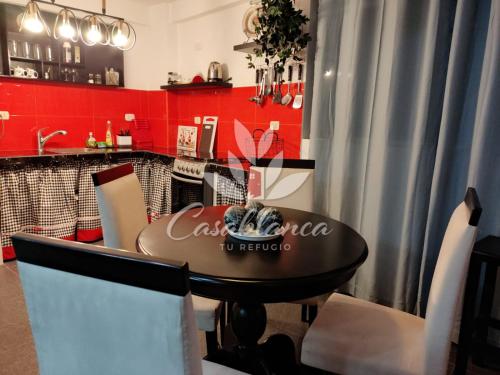 a dining room with a cocacola sign on a table at Casablanca 3 in Tacna