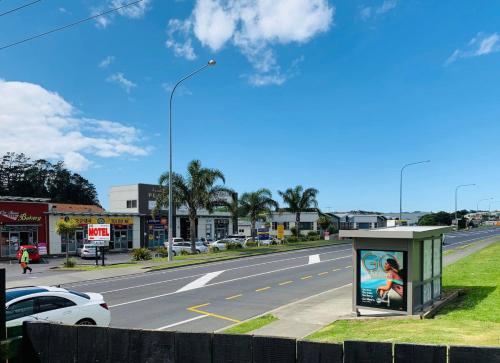 a view of a city street with a road at Albany Modern Private 2 bedroom 2 bathroom with Full Kitchen Netflix in Auckland
