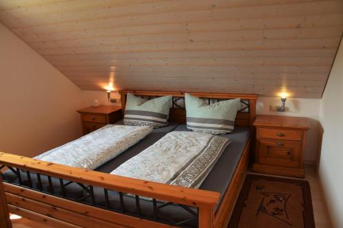 a bedroom with two beds and two night stands at Bauernhof Dieing in Isny im Allgäu