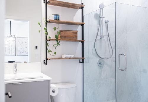 a bathroom with a shower and a toilet and a sink at Glades and Greens by Revelstoke Vacations in Revelstoke