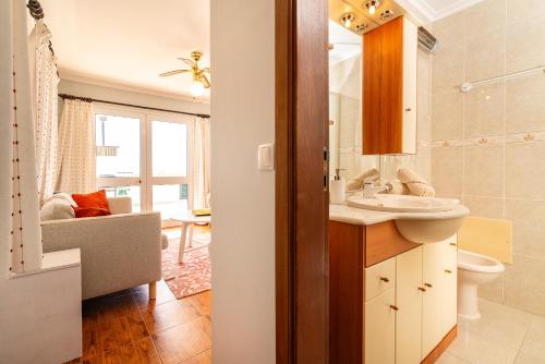 a bathroom with a sink and a toilet at Noite´s House - Prazeres in Prazeres