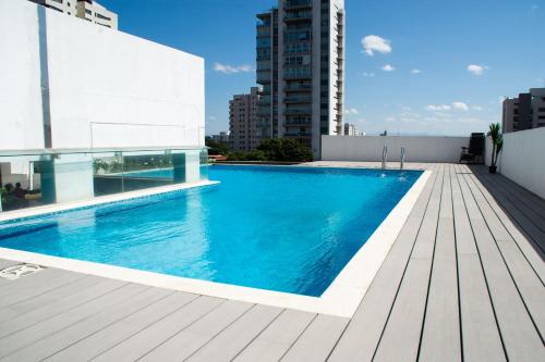 a swimming pool on the roof of a building at PIHARE II in Santa Cruz de la Sierra