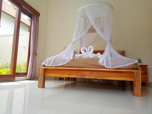 Cama o camas de una habitación en Ubud nadi villa