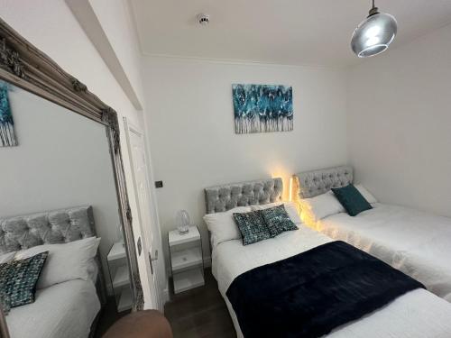 Ένα ή περισσότερα κρεβάτια σε δωμάτιο στο 2 bedroom flat close to Manchester City, Manchester City stadium and Coop Arena