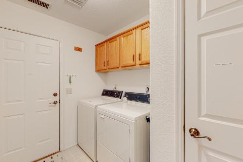 a white laundry room with a washer and dryer at Sky Trail Retreat in Sedona