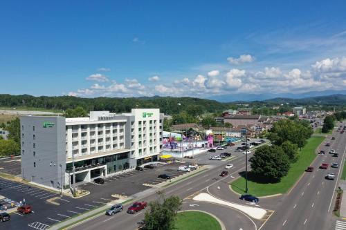 an aerial view of a city with a highway at Holiday Inn & Suites Pigeon Forge Convention Center by IHG in Pigeon Forge