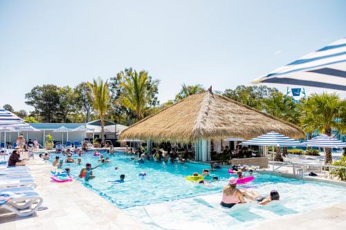 a group of people in a pool at a resort at BIG4 Sandstone Point Holiday Resort Bribie Island in Bongaree