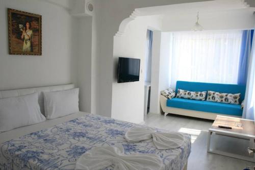 Cama o camas de una habitación en Mavi Butik Apart