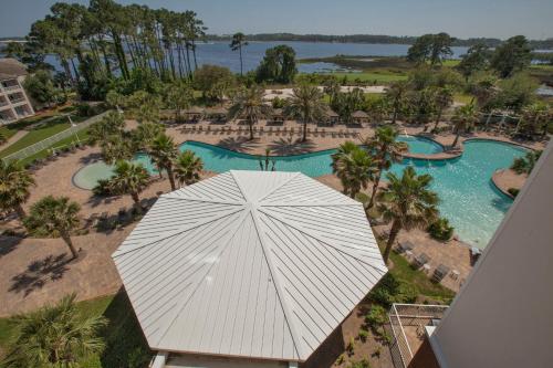 an overhead view of a pool with a white umbrella at Reflections by Panhandle Getaways in Panama City Beach