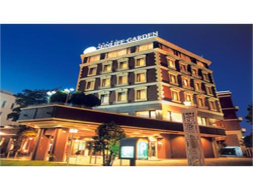 a building with a sign on top of it at Hotel Sunlife Garden - Vacation STAY 55409v in Hiratsuka