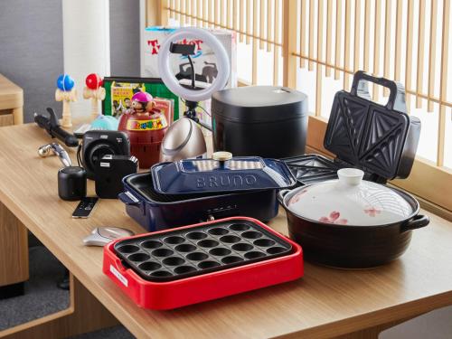 a table with dishes and other kitchen items on it at MIMARU Kyoto Nishinotoin Takatsuji in Kyoto
