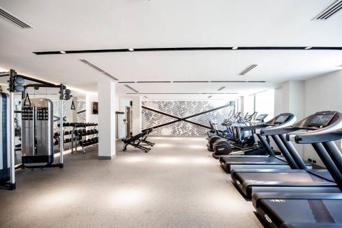 a gym with rows of treadmills and machines at Residence Inn by Marriott Dallas Frisco in Frisco