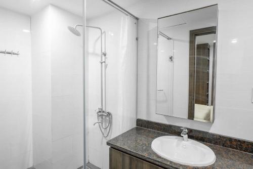 a bathroom with a sink and a shower at Apartment 1994 Đà Lạt center in Da Lat