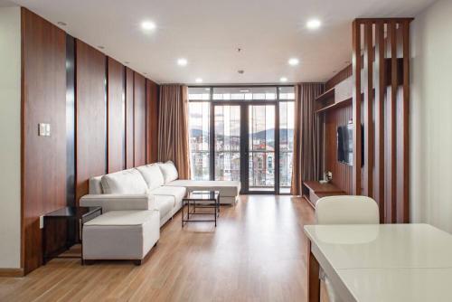 a living room with a couch and a table at Apartment 1994 Đà Lạt center in Da Lat