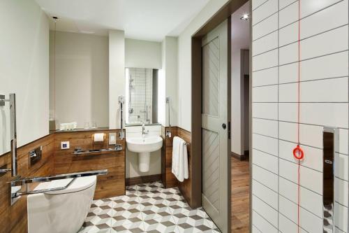 a bathroom with a toilet and a sink at Residence Inn by Marriott London Bridge in London