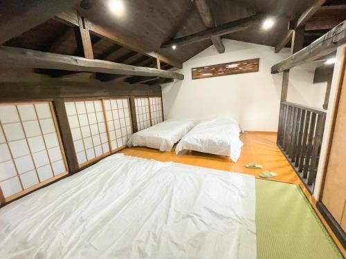 a room with two beds on the floor at One Night, One View, Lifelong Marriage, Yotsukaido - Vacation STAY 12735 in Yotsukaidō