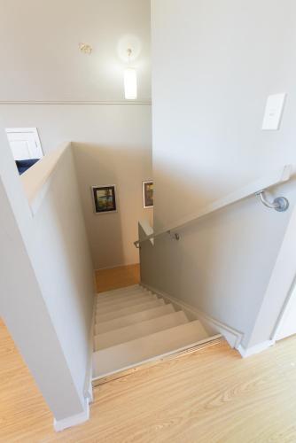 a view of a staircase in a house at Tokerau Magic - Karikari Peninsula Holiday Home in Kaitaia