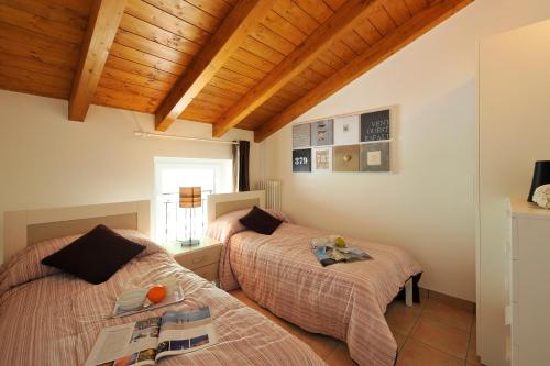 Posteľ alebo postele v izbe v ubytovaní Casa Mastena Vista Lago