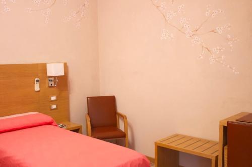 Albergo Giulia Gonzagaにあるベッド