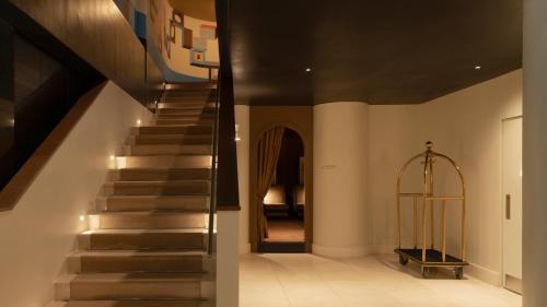 a staircase in a house with a stair case at Amid Hotel Seoul in Seoul