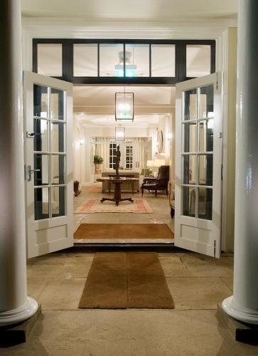an open door to a living room with a table at Congham Hall Hotel & Spa in Grimston