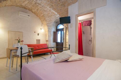 Ένα ή περισσότερα κρεβάτια σε δωμάτιο στο Dammuso Romantico
