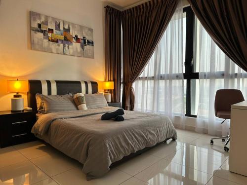 a bedroom with a large bed and a large window at Educity Legoland Eco Botanic Homestay in Johor Bahru