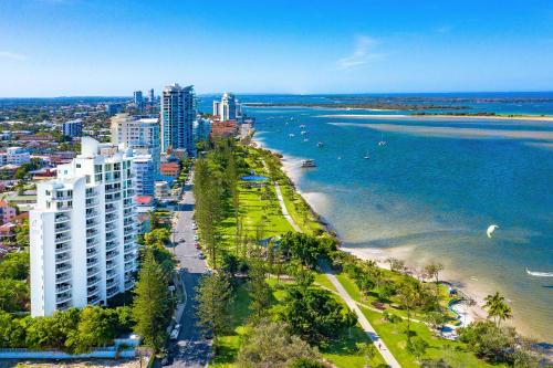 an aerial view of a city with a beach and buildings at Crystal Bay On The Broadwater in Gold Coast