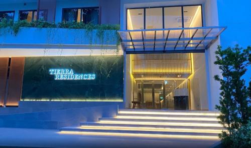 a building with stairs in front of a building at Tierra Residences in Bangkok