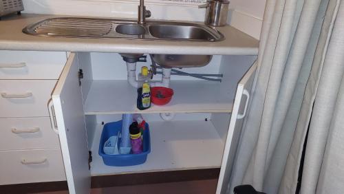 a kitchen with a sink and a sink at Barefoot Base Tupapa in Rarotonga