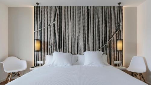 A bed or beds in a room at Bordoy Alcudia Bay - Adults Only