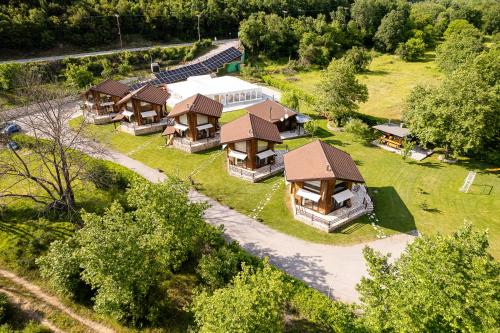 an overhead view of a group of cottages at Natura Chalets in Méga Khoríon