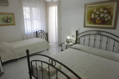 Katil atau katil-katil dalam bilik di B&B Terre del Sinis