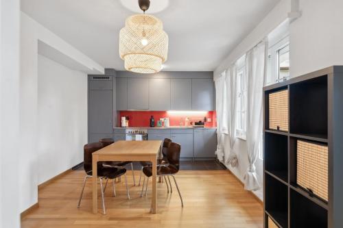 a kitchen with a table and chairs in a room at Muenstergasse Zurich Old Town in Zürich