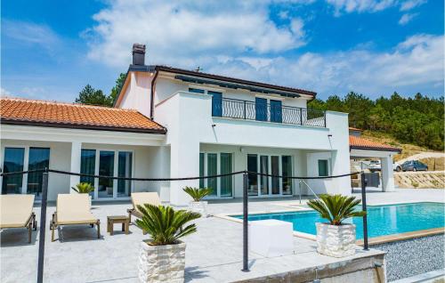 a villa with a swimming pool and a house at Villa Bella Draguc in Draguć