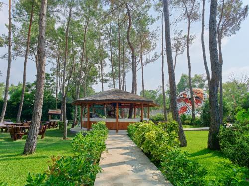 a gazebo in a park with trees at Maxx Royal Belek Golf Resort in Belek